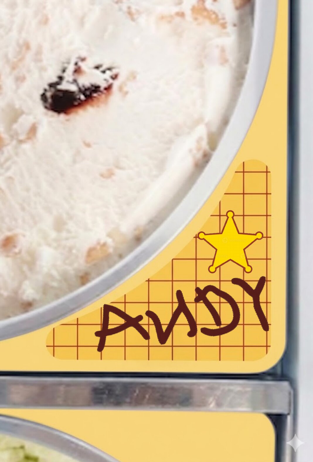 ANDY written on the scoop cabinet skirt